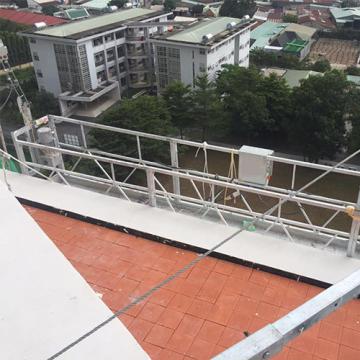 Temporarily installed building maintenance unit hoist suspended platform