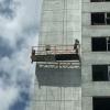 Temporarily installed building maintenance unit hoist suspended platform